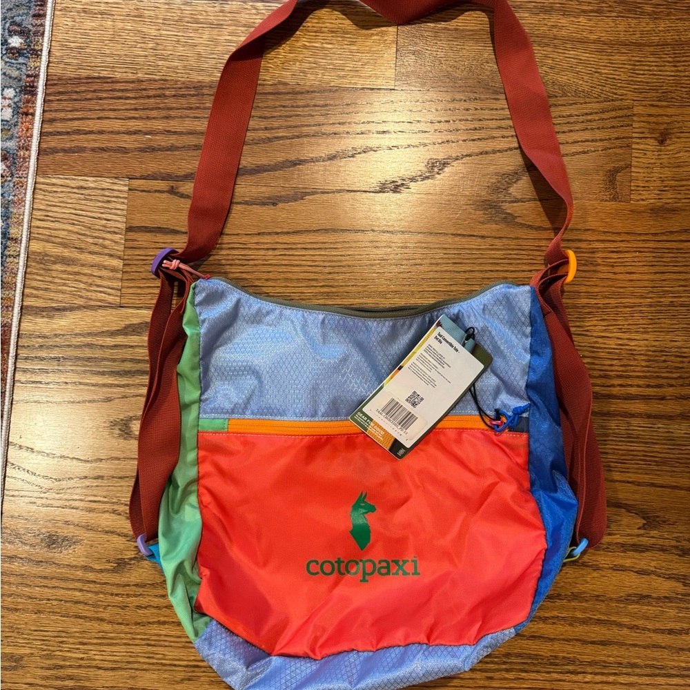 Cotopaxi Taal Convertible Tote in Vibrant Red and Blue